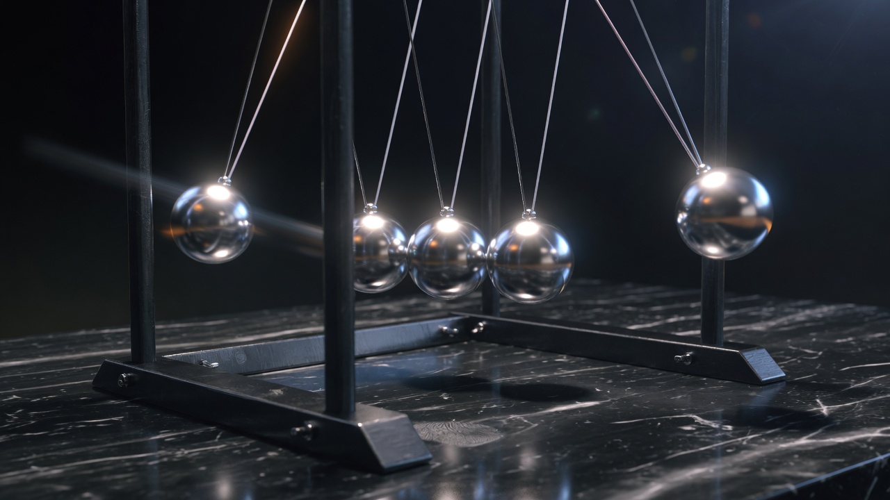 Newton’s cradle steel spheres in motion